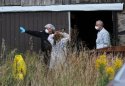 Forensic investigators at Millard farm.jpg