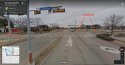 3-Centennial @ Bowser, insection facing NW; alley behind watch sign.jpg