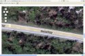 LISK Marsh Google2010 What is to left & is that person on shoulder.jpg