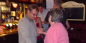 Who is man in dark Blue T Shirt.png