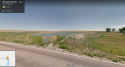 Ditch at squirrel creek rd with pond.png