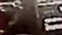 What looks like arm from behind gas pump Jessica is about to use.jpg