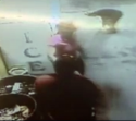 Red wearing woman with glass propped on head says hi to pink deli lady - Edited.png