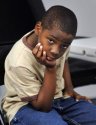 Moses Shakespeare, 8, listening to his grandma Feb 4, 2010.jpg