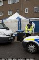 2C55D6DF00000578-3235405-Investigation_Police_and_forensics_investigators_are_pictured_ou-m-22_1.jpg