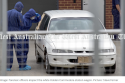 Forensic officers inspect the white Holden Commodore station wagon. Picture Steve Ferrier.PNG