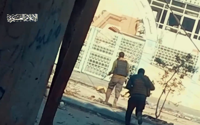 This screenshot from a Hamas video published November 19, 2023, shows terror operatives storming Gaza's Rantisi Hospital. (Screenshot: X)