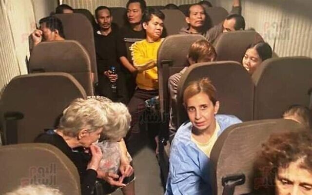 The hostages released by Hamas in an ambulance en route to Israel on November 24, 2023. (Screen capture/Youm7)