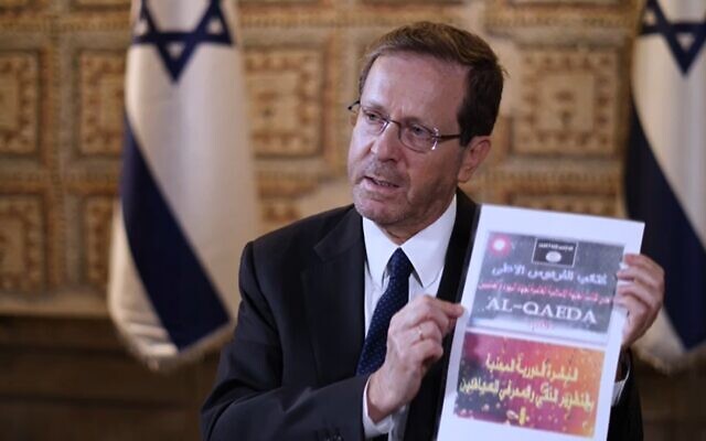 President Isaac Herzog shows materials recovered from the body of a Hamas terrorist during an interview with Sky News, October 22, 2023. (Screenshot)