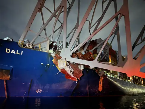 facebook The Singapore-flagged container ship, Dali, struck a column on the 47-year-old bridge at 01:30 local time (05:30 GMT), causing it to collapse.
