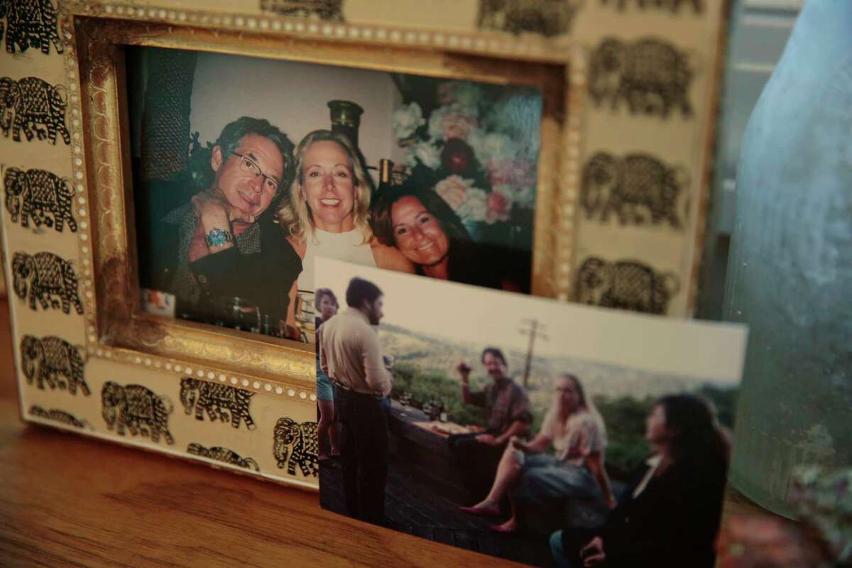 Photographs of Adrienne Spohr’s parents are displayed in her home. Investigators said they have new clues that lead them to believe someone hired the shooter to kill the couple in 2021, and that whoever put up the money for the job may be from the Reno area.  