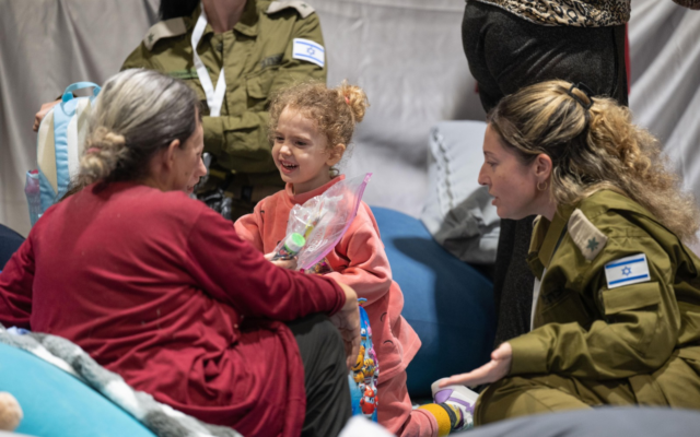 Yahel Shoham, 3, is seen with grandmother Shoshan Haran, 67, upon their return to Israel after 50 days in Hamas captivity in Gaza, where they were held with Yahel's mother Adi and her son Naveh, 8, on November 25, 2023. (Courtesy)