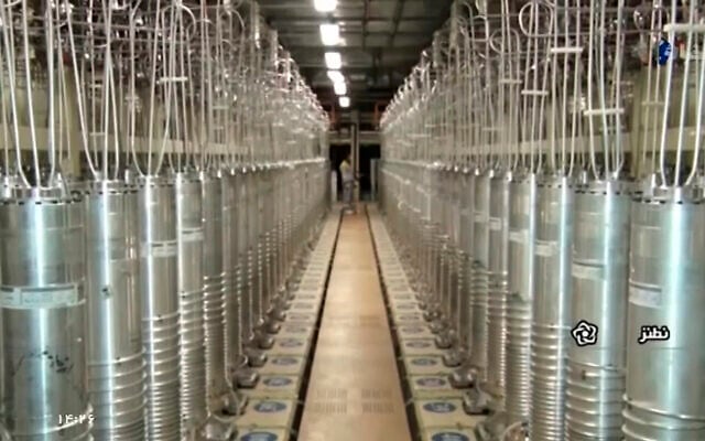 Centrifuges line a hall at the Uranium Enrichment Facility in Natanz, Iran, in a still image from a video aired by the Islamic Republic Iran Broadcasting company on April 17, 2021, six days after the hall had been damaged in a mysterious attack. (IRIB via AP)