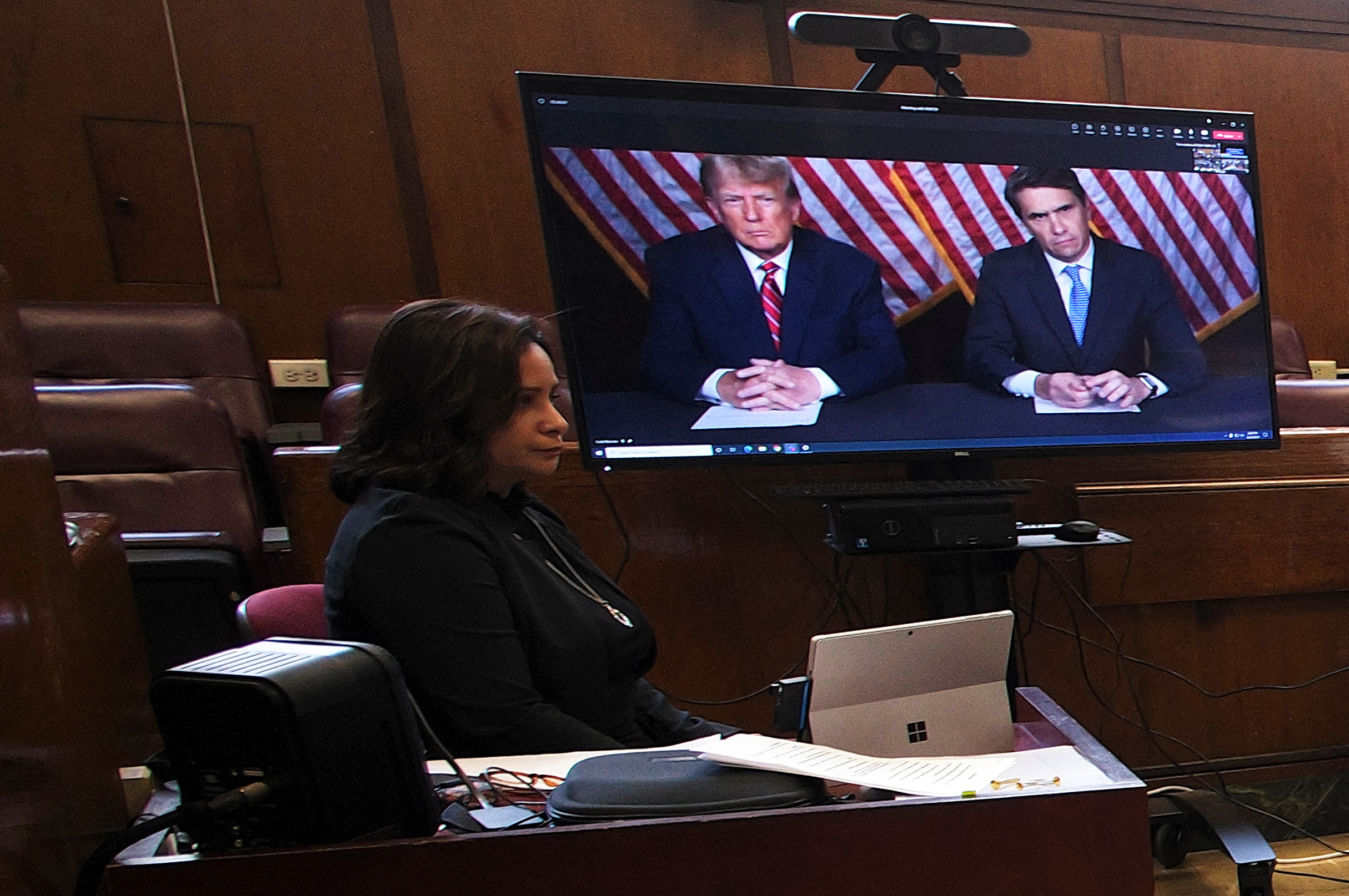 Former U.S. President Donald Trump appears by video conferencing before Justice Juan Merchan during a hearing regarding the criminal case against him over a hush money payment to porn star Stormy Daniels, in New York City