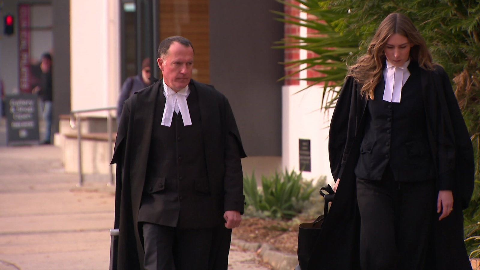 Barristers outside a courtroom