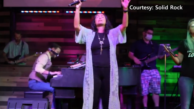 Mica Miller singing on the praise team at Solid Rock Church. (Credit: Solid Rock)