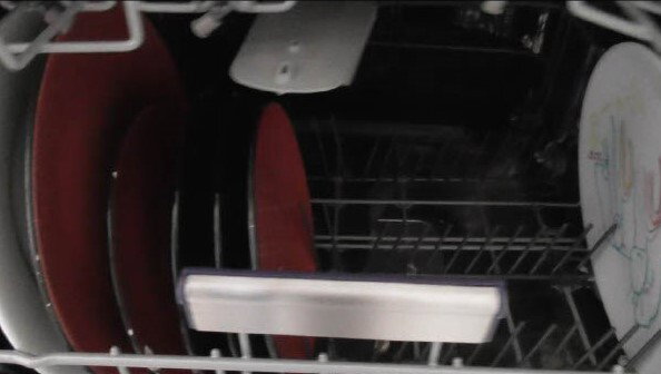 Plates in a dishwasher.