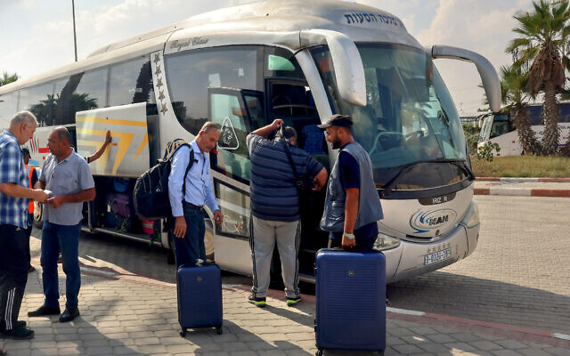 Dual national Palestinians and foreigners prepare to cross the Rafah border point with Egypt, in the southern Gaza Strip, on November 2, 2023.  (Photo by SAID KHATIB / AFP)