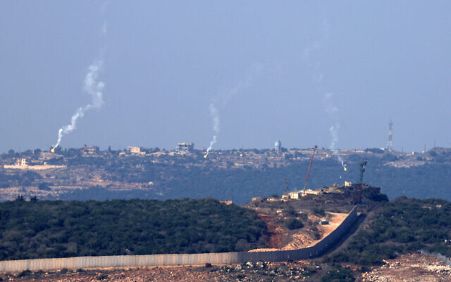 Illustrative: Flares are fired from northern Israel over the southern Lebanese border village of Aita al-Shaab, on October 28, 2023. (FADEL SENNA / AFP)