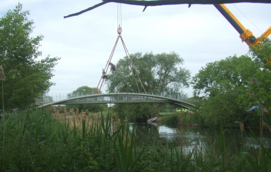 The new cycle/footbridge being lifted into position across the River Great Ouse, May 25th 2011