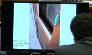 outside-of-toilet-door-with-green-key.png
