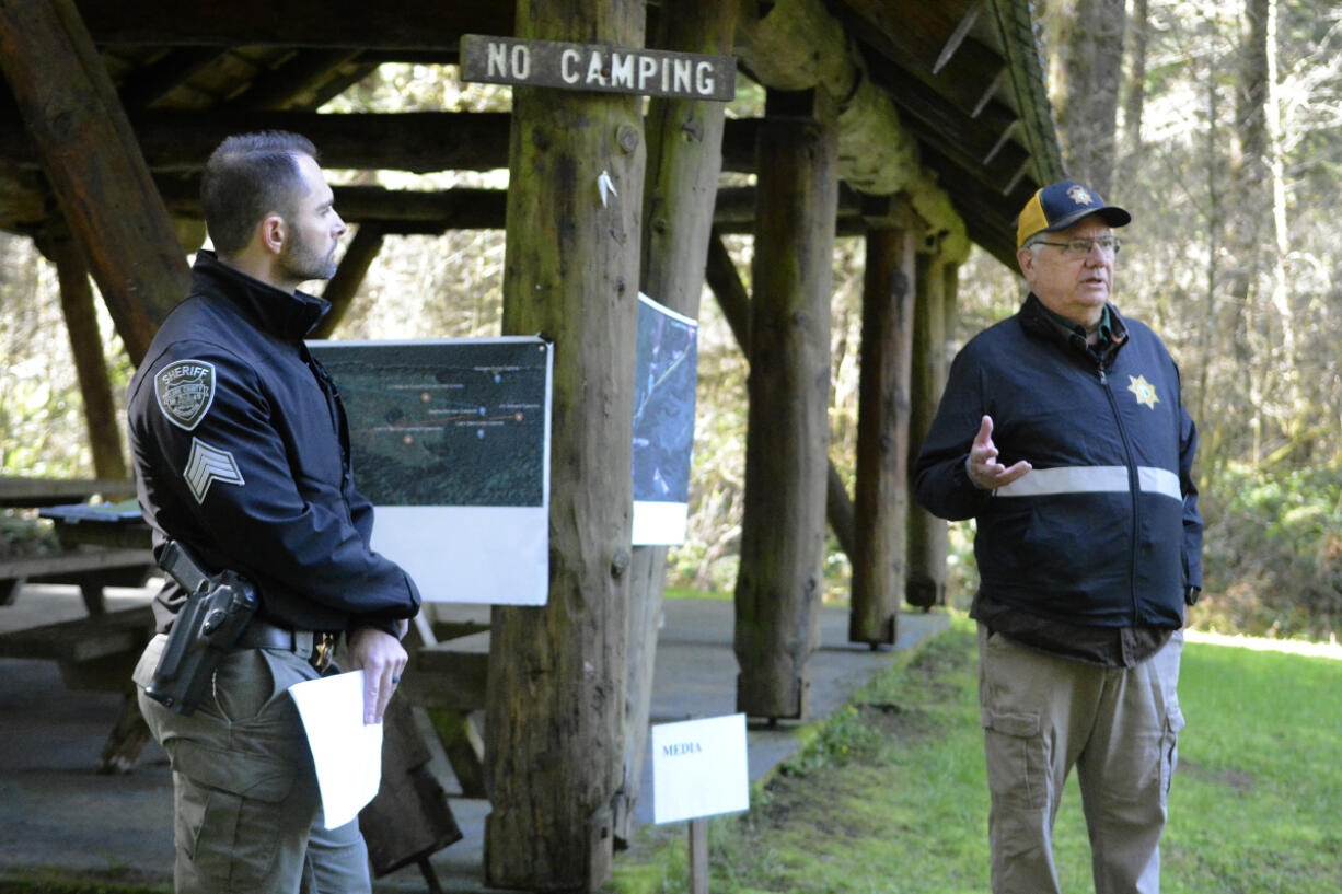 Cold-case investigator Doug Maas, right, and Clark County sheriff&rsquo;s Sgt. Matt Volker hold a briefing late Saturday morning with media before a search of the Dole Valley area for the remains of teenager Jamie Grissim. The 16-year-old went missing in 1971. She is presumed to be a victim of convicted killer Warren Forrest. Saturday&rsquo;s search concluded without recovering any evidence.