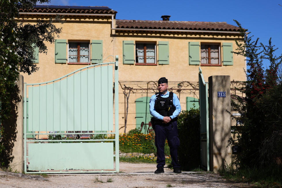 An officer stands outside the house of the grandparents of Emile Soleil in La Bouilladisse, southeastern France, on March 25, 2025.