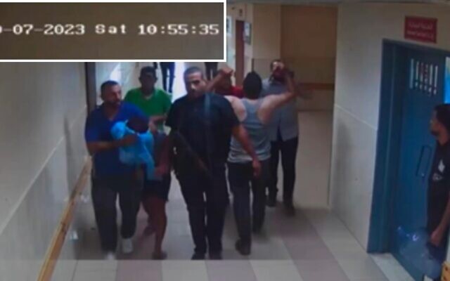 Hamas terrorists bring a hostage into Shifa Hospital as seen on surveillance footage from October 7, 2023. (IDF) Hamas terrorists bring a hostage into Shifa Hospital as seen on surveillance footage from October 7, 2023. (IDF)