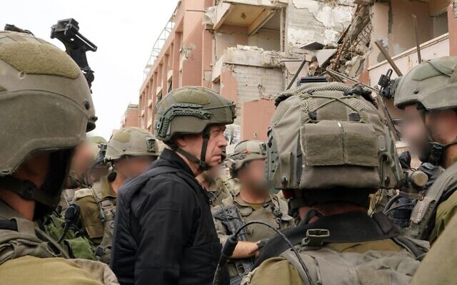 Defense Minister Yoav Gallant speaks with troops in the northern Gaza Strip, November 25, 2023. (Ariel Hermoni/Defense Ministry) Defense Minister Yoav Gallant speaks with troops in the northern Gaza Strip, November 25, 2023. (Ariel Hermoni/Defense Ministry)